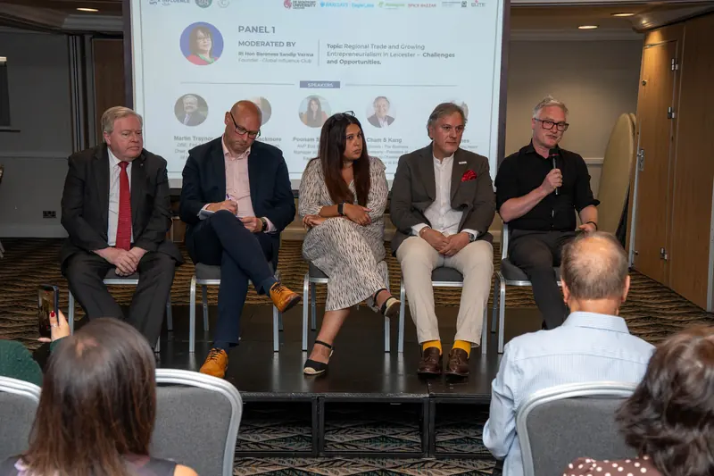 A panel discussion on stage at a No.28 event