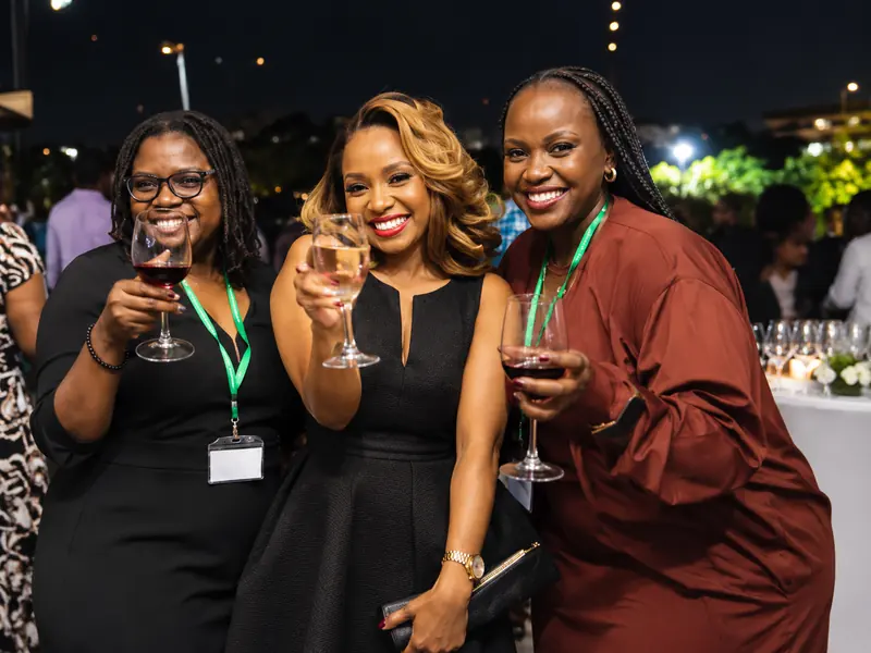 Guests raising a toast at an evening reception