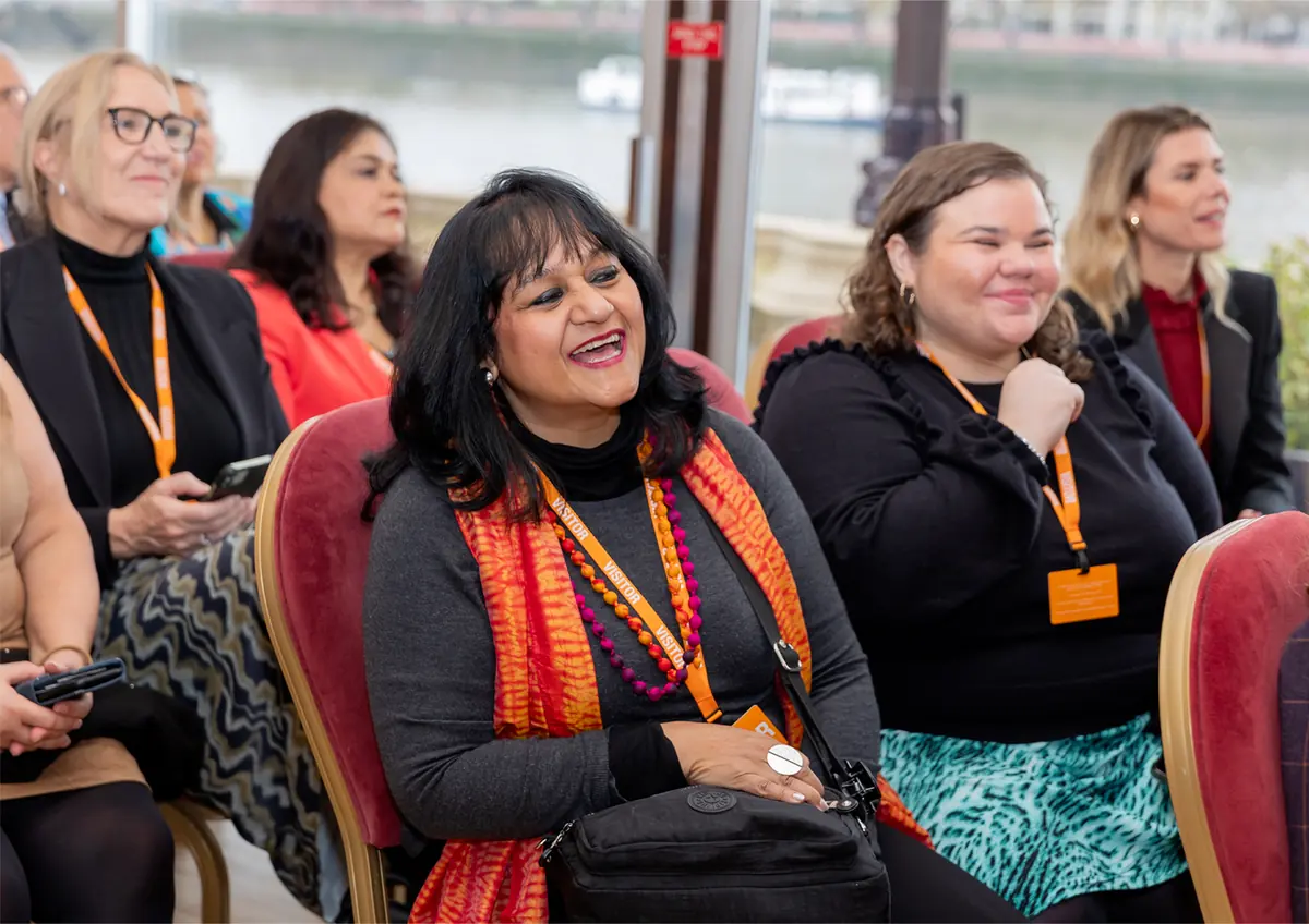 Members laughing together in the audience at a No.28 event