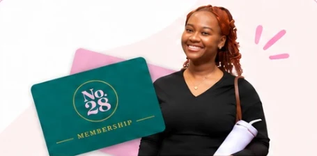 A smiling member next to a No.28 membership card
